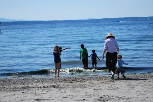 Grandma is not afraid to get wet and dirty with all the kids.